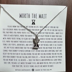 Bryan Anthony’s “Worth the Wait” necklace with hourglass and rhinestone pendant.